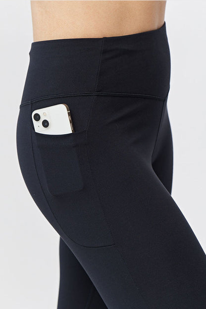Black Goal Five women's cropped training leggings, 21-inch length, fitted and stretchy for active workouts.