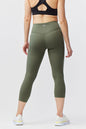 Goal Five women's black cropped training leggings, 21-inch length, showing fit and stretch details on model.