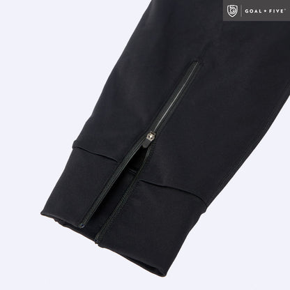 Black Valia women's training jogger pants by Goal Five, shown fitted on a model, with a relaxed athletic style and elastic waistband.