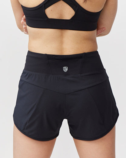 Sheva women's high rise running shorts by Goal Five in hot coral, designed for comfortable training and active wear.