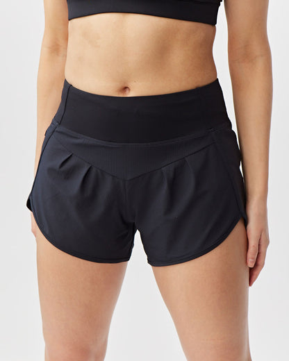 Goal Five Sheva women's high-rise running shorts in hot coral, designed for comfortable training and active wear.