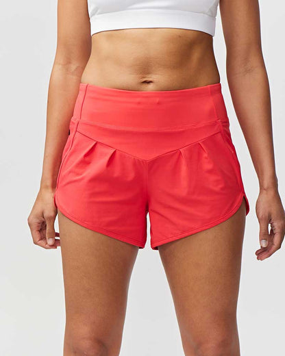 Goal Five Sheva women's high-rise running shorts in vibrant hot coral, suitable for training and active wear.
