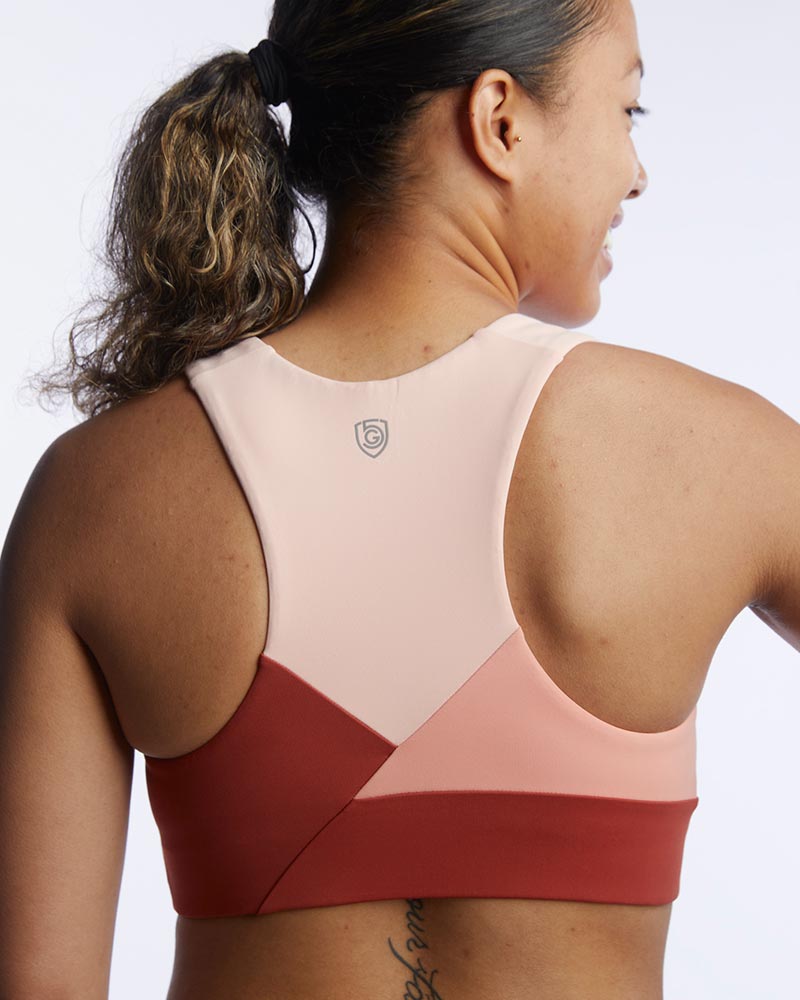 Goal Five Pionxr Bra Top for training, in rose cinnabar nectar color, shown in a close-up image highlighting the fabric and fit.