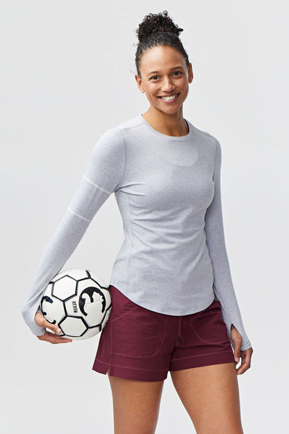 White Foudy women's long sleeve workout top by Goal Five, designed for training and active wear.