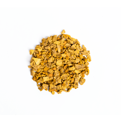 Organic golden turmeric and ginger blend in a package by Nepal Tea, showcasing fresh turmeric roots and ginger slices.