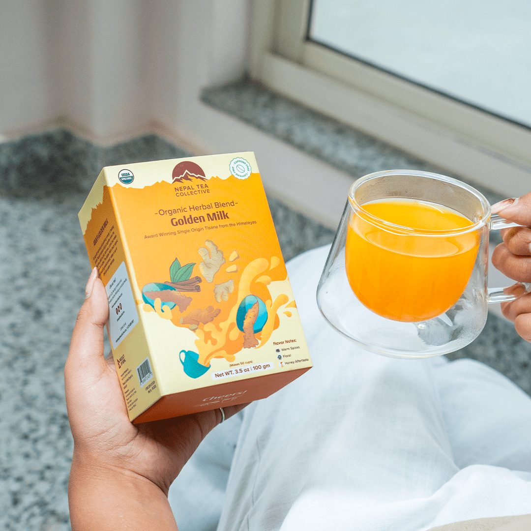 Organic Golden Milk blend from Nepal Tea, showing a warm, golden turmeric-infused powder in a glass jar with a rustic background.