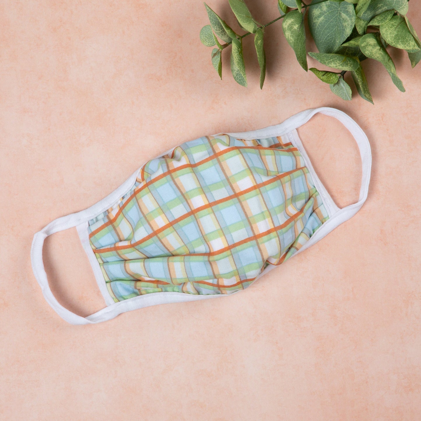 Vibrant cloth face mask with Americana design by GreaterGood, made in the USA, featuring colorful patterns and comfortable fit.
