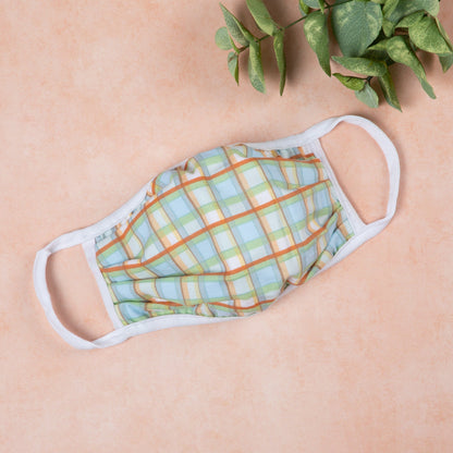 Vibrant cloth face mask with Americana design by GreaterGood, made in the USA, featuring colorful patterns and comfortable fit.