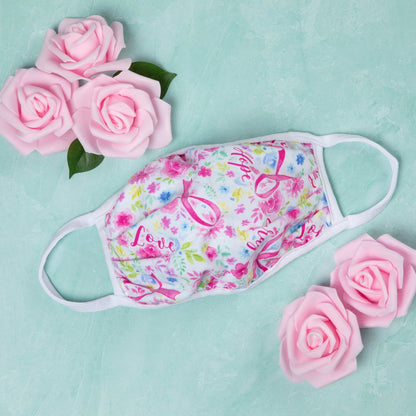 Vibrant cloth face mask with Americana design by GreaterGood, made in the USA, showing colorful fabric and mask straps.
