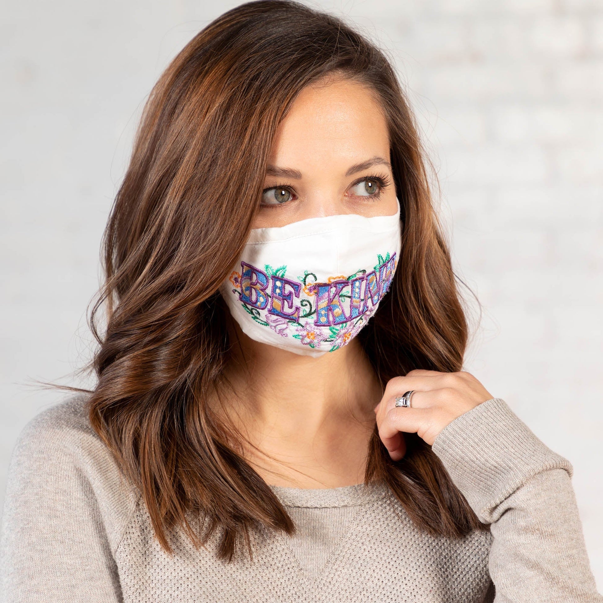 GreaterGood Read My Lips embroidered face mask with "Be Kind" message, comfortable fabric, and adjustable ear loops.
