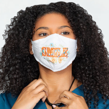 GreaterGood Read My Lips embroidered face mask with "Be Kind" message, made of soft fabric, featuring colorful embroidery design.