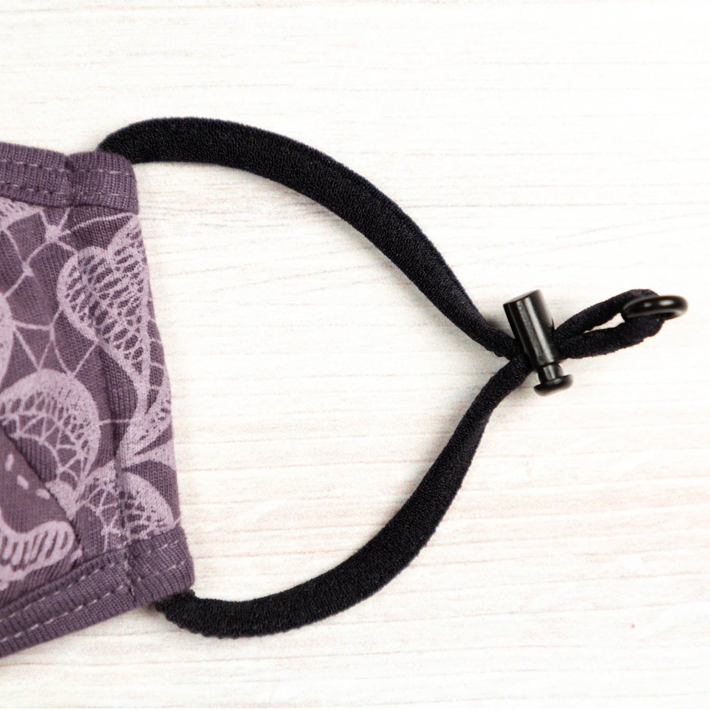 Blue Reversible Organic Face Mask by GreaterGood with patched design, made for comfortable, eco-friendly face covering.