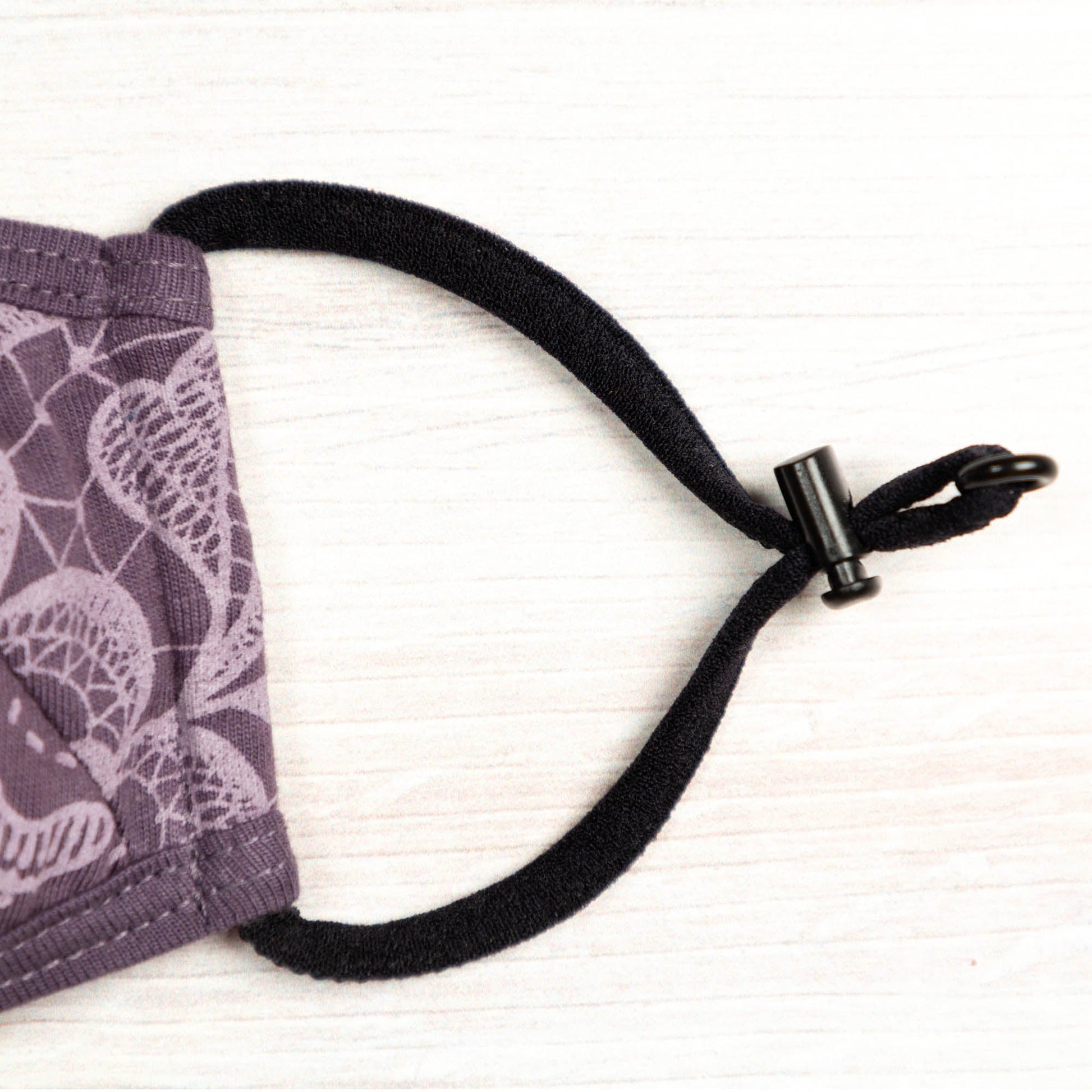 Blue Reversible Organic Face Mask by GreaterGood with patched design, made for comfortable, eco-friendly face covering.