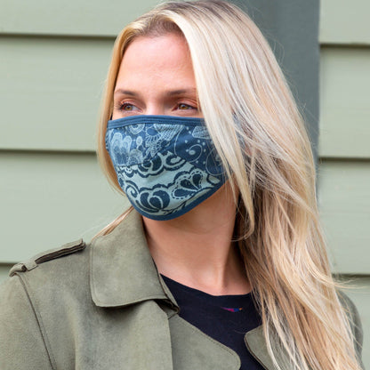 Blue Patched Together Organic Reversible Face Mask by GreaterGood, showing the dual-sided design and comfortable fit.
