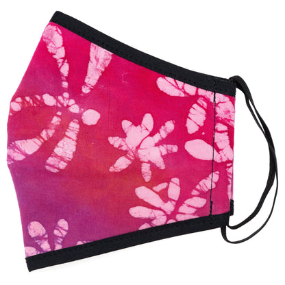 Batik Delight face mask by GreaterGood with dragonfly and floral batik design, made of soft fabric for comfortable wear.