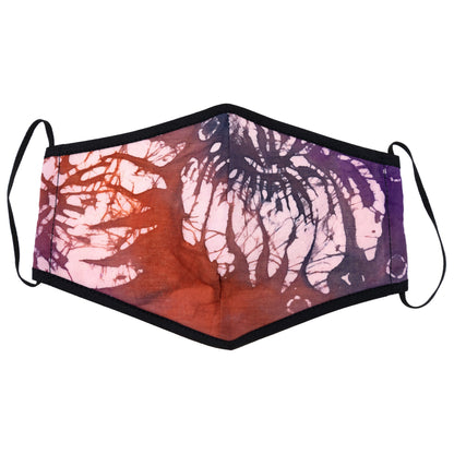 Batik Delight face mask by GreaterGood featuring vibrant dragonfly and floral designs, made of soft fabric for comfortable wear.