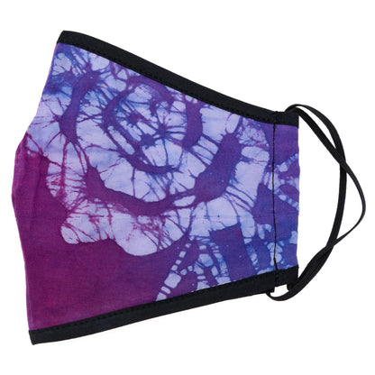 Batik Delight face mask by GreaterGood featuring a colorful dragonfly and floral pattern, made of fabric for comfortable wear.