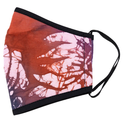 Batik Delight face mask by GreaterGood with a colorful dragonfly pattern, made of soft fabric for comfortable wear.