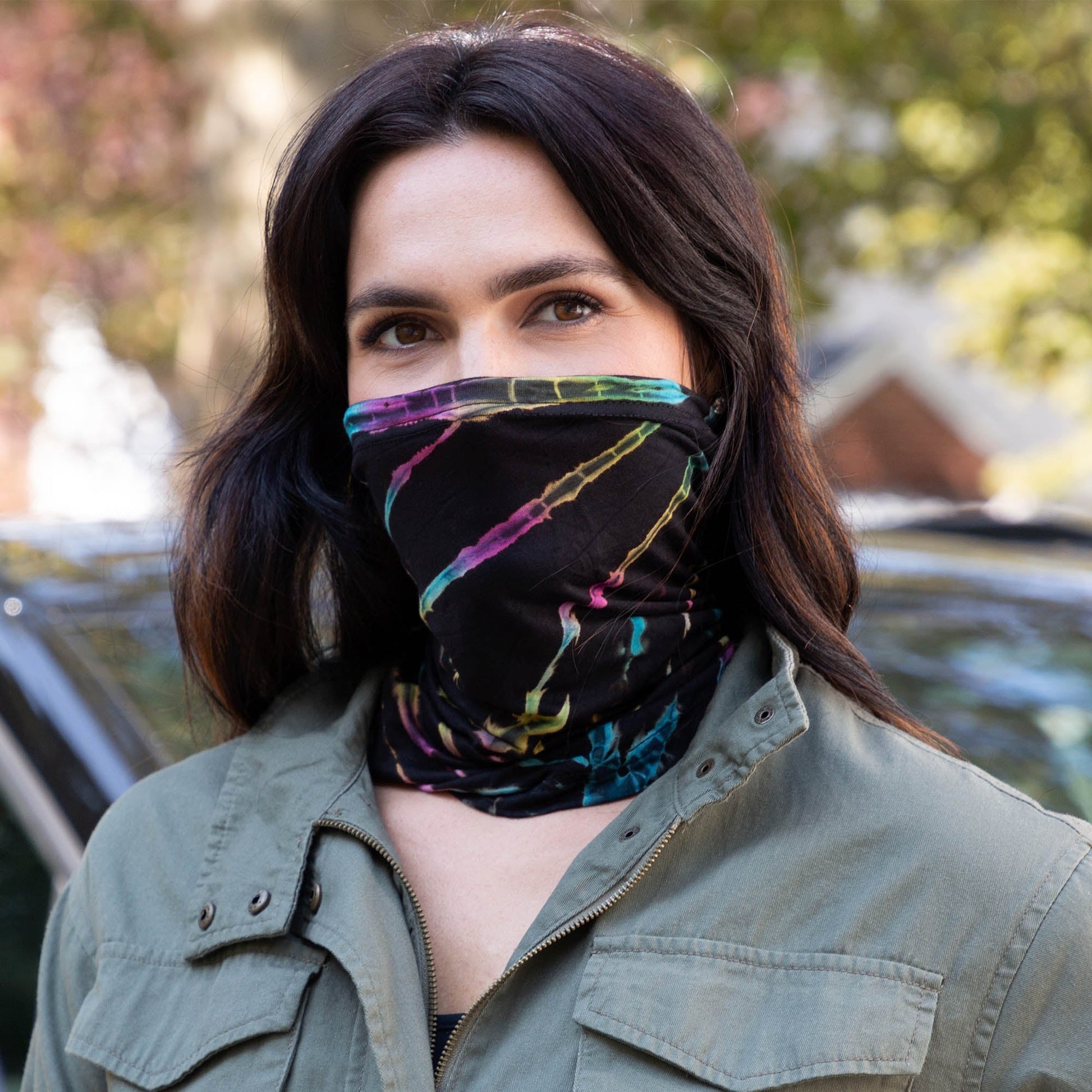Colorful tie-dye gaiter face mask by GreaterGood, made from soft fabric, designed for comfortable face covering and style.