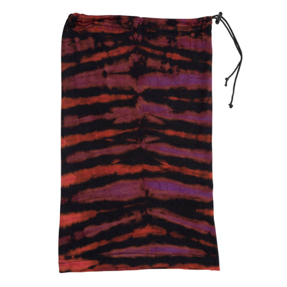 Colorful tie-dye gaiter face mask by GreaterGood, made of breathable fabric, worn covering nose and neck for protection and style.