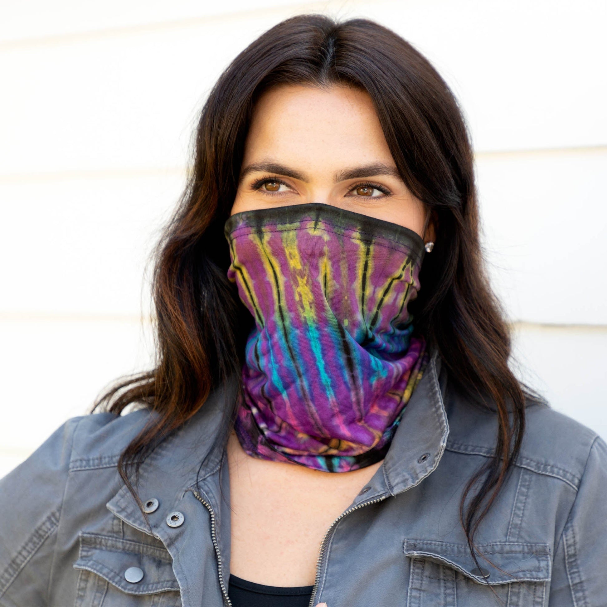 Colorful tie-dye gaiter face mask by GreaterGood, made of soft fabric, designed for comfortable face covering and protection.