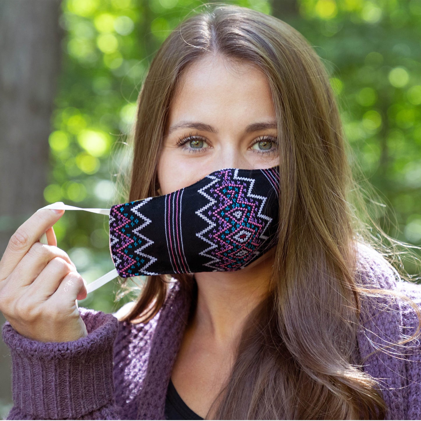 Handwoven face mask from GreaterGood, showcasing intricate fabric patterns and comfortable fit for face protection.