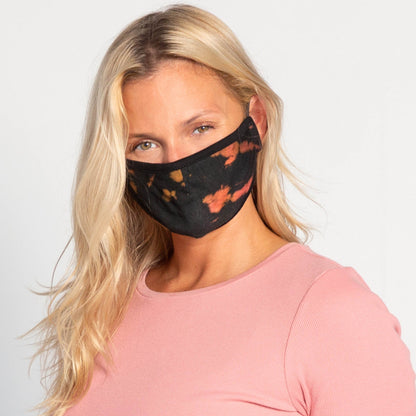 Set of three tie-dye face masks by GreaterGood, protective fabric masks with ear loops and colorful patterns.
