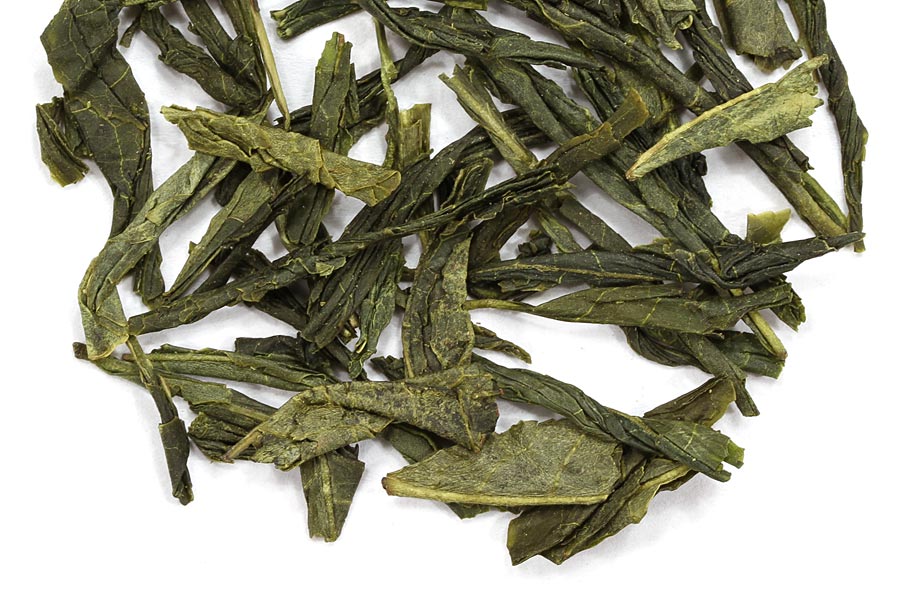 Loose leaf green tea from China with vibrant green tea leaves, ideal for brewing fresh green tea.