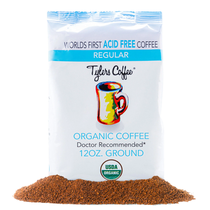 Ground acid-free coffee from Tylers Coffees, showing freshly ground coffee beans in a clear container.