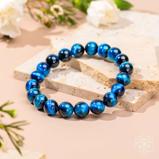 Royal blue Tiger’s Eye bracelet from Hawk’s Focus by Conscious Items, featuring polished stone beads and an adjustable cord.