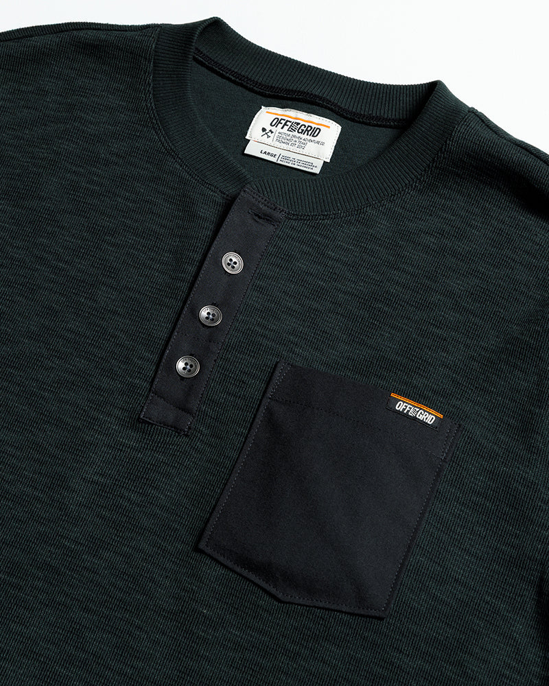 Black vintage Draper Henley long-sleeve shirt by Off The Grid Surplus, featuring a classic button-up collar and textured fabric.