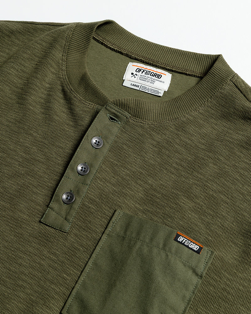 Dark olive Draper Henley long sleeve shirt by Off The Grid Surplus, shown in a close-up image highlighting the fabric and fit.