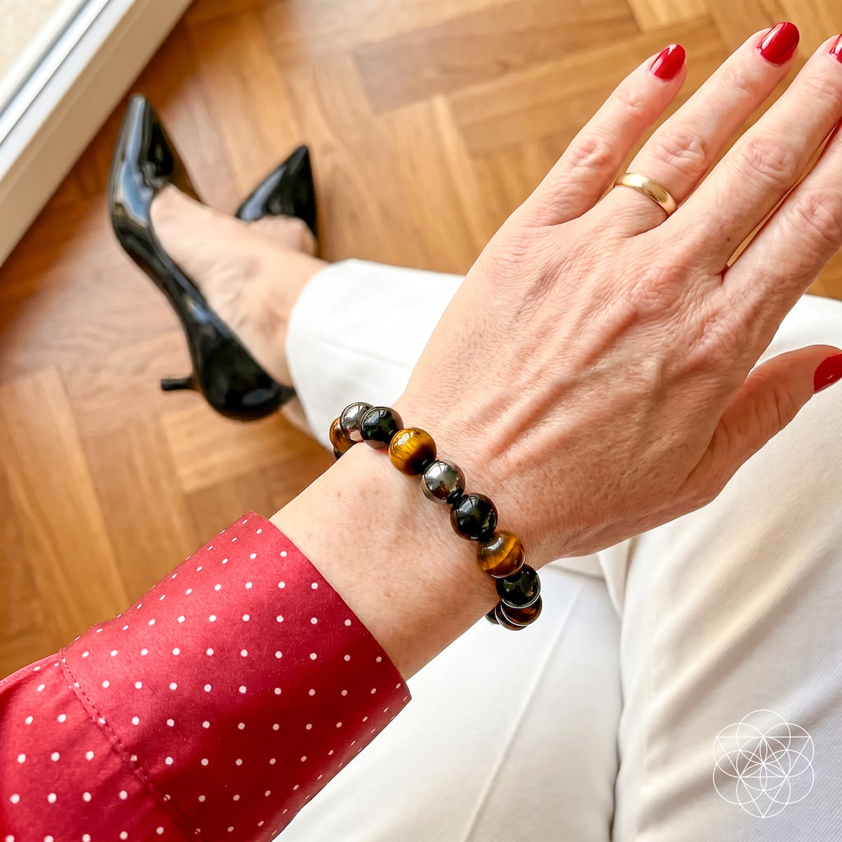 Conscious Items Triple Protection Bracelet featuring multiple strands of black and silver beads on a cord bracelet.