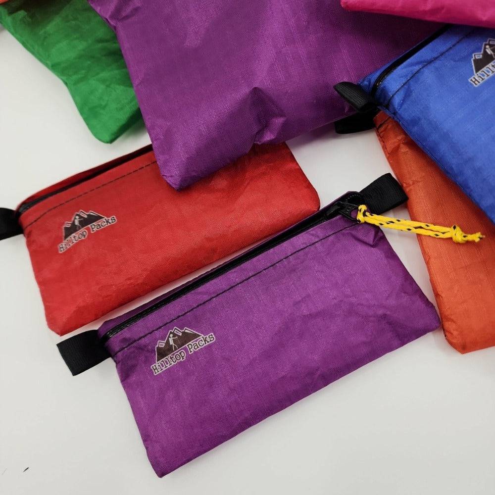 White ultralight zipper pouch organizer with classic pattern by Hilltop Packs LLC, compact and versatile for daily use.