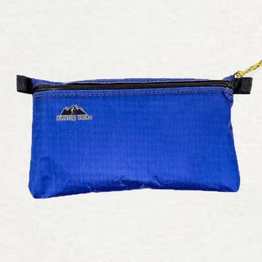 Ultralight zipper pouch organizer with classic pattern by Hilltop Packs LLC, white fabric with colorful design for travel and storage.
