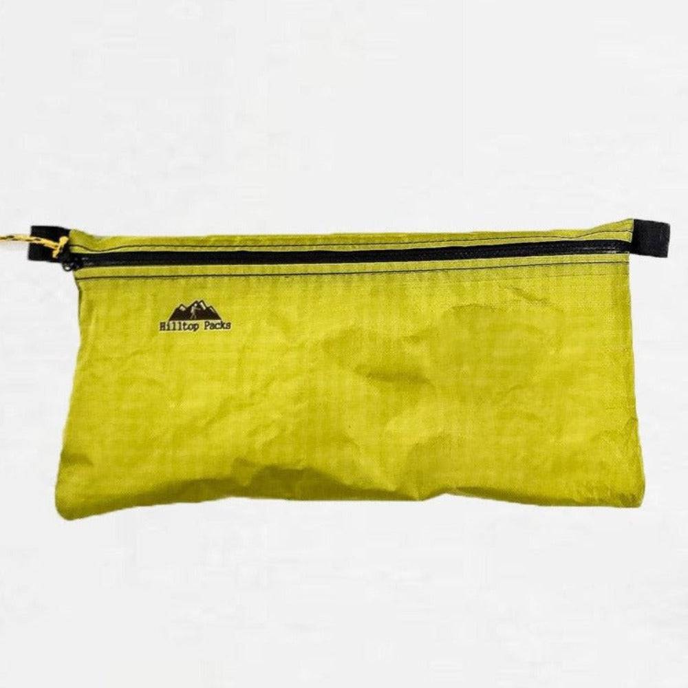 White ultralight zipper pouch organizer with classic pattern by Hilltop Packs LLC, ideal for travel and storage.