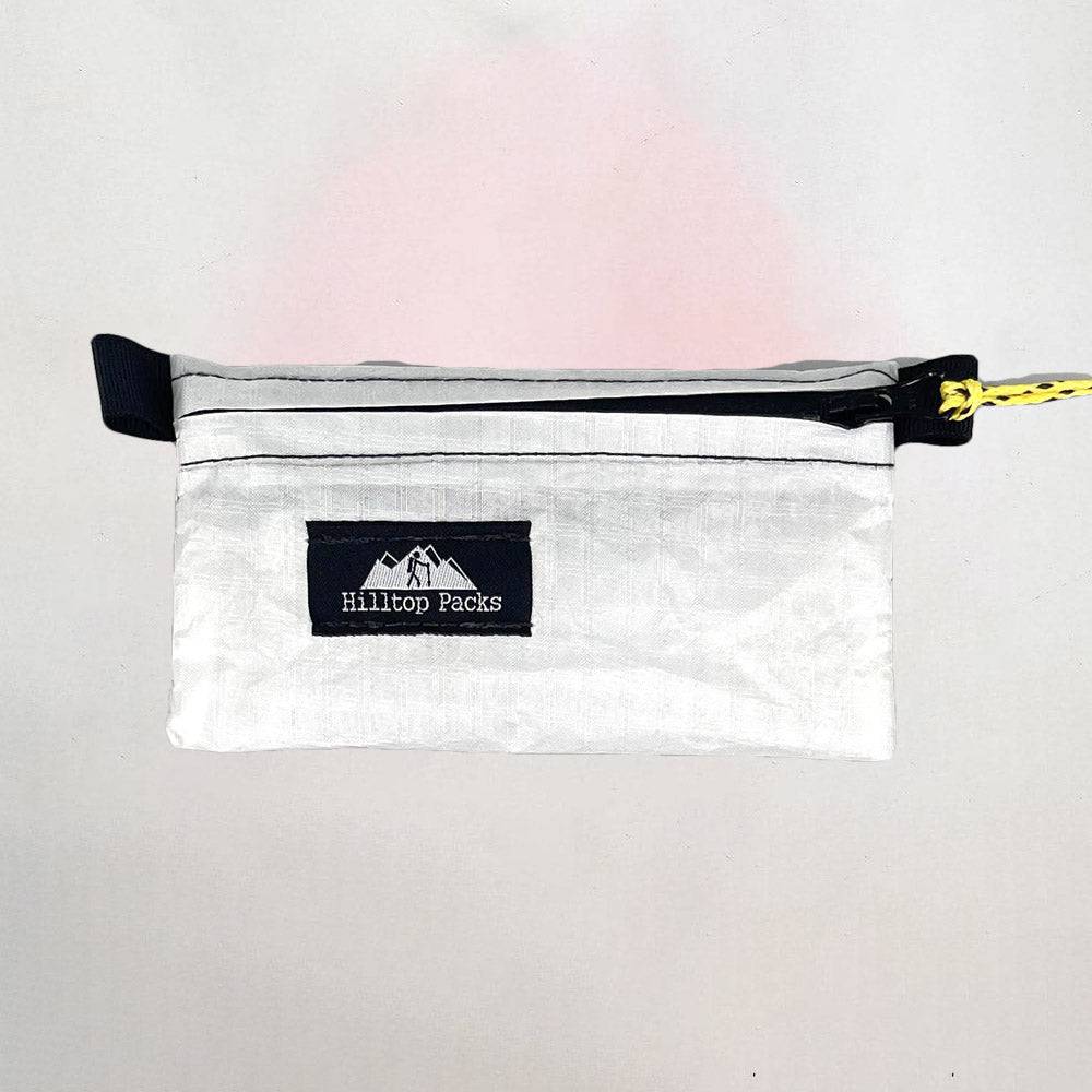 White ultralight zipper pouch organizer with classic pattern by Hilltop Packs LLC, compact and lightweight storage solution.