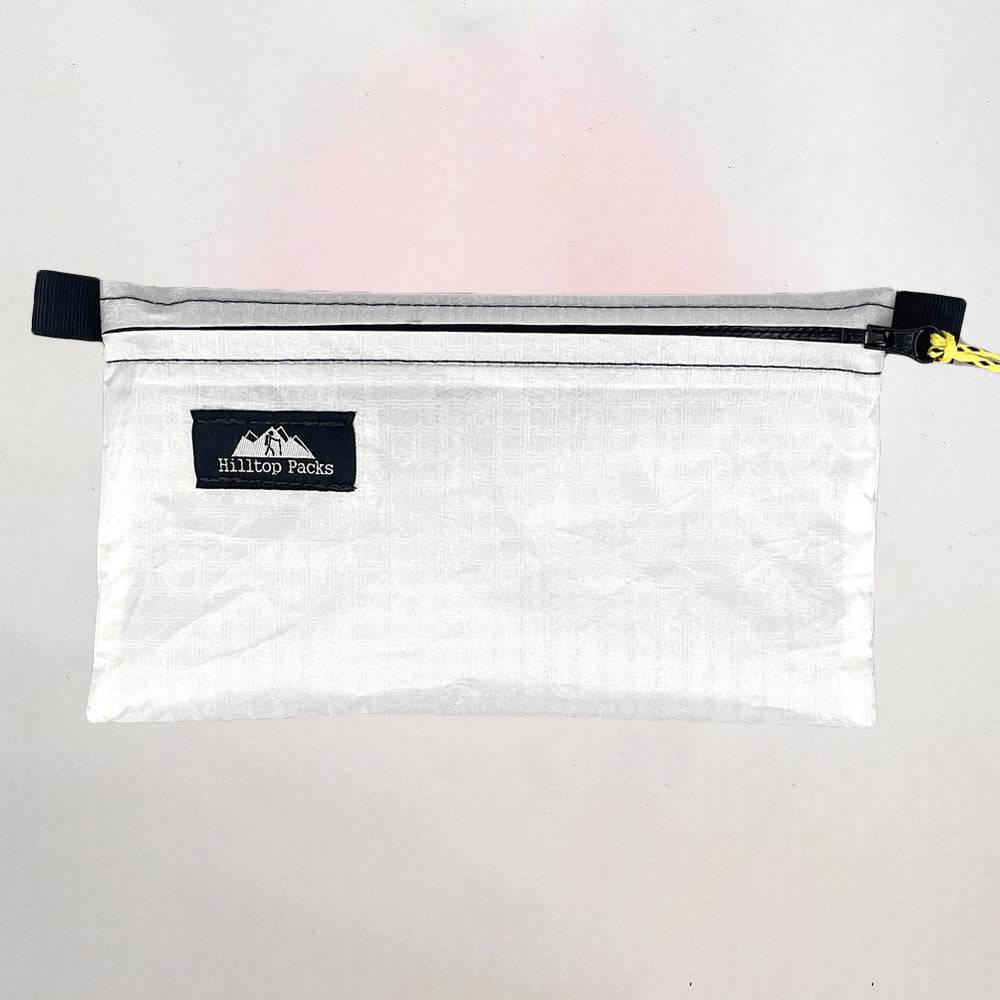 White ultralight zipper pouch organizer with classic pattern from Hilltop Packs LLC, ideal for travel and storage.