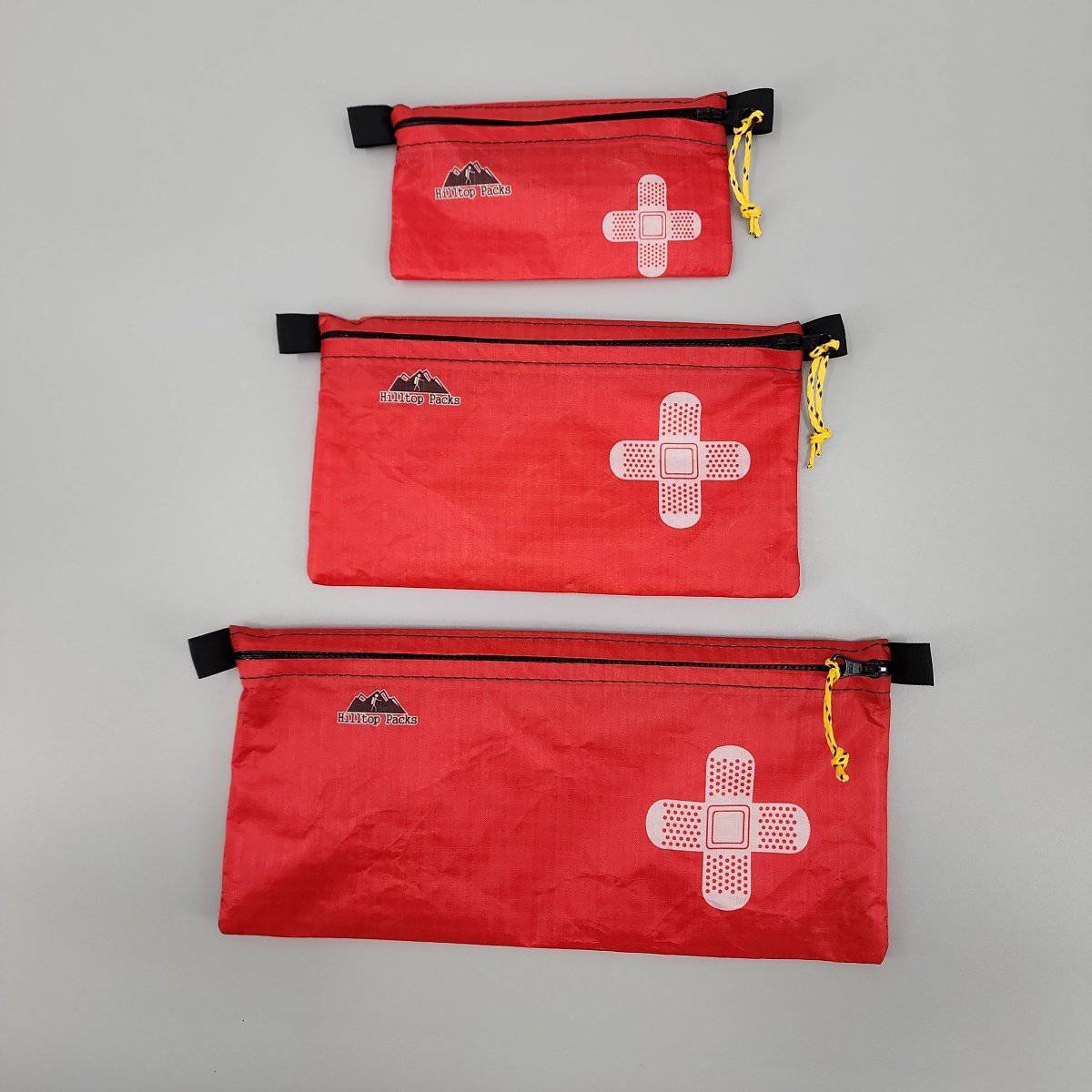 Ultralight zipper pouch organizer with classic patterns, compact design by Hilltop Packs LLC for travel and everyday use.
