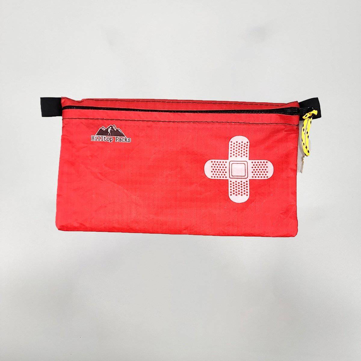White ultralight zipper pouch organizer with classic patterns by Hilltop Packs LLC, compact and versatile storage solution.