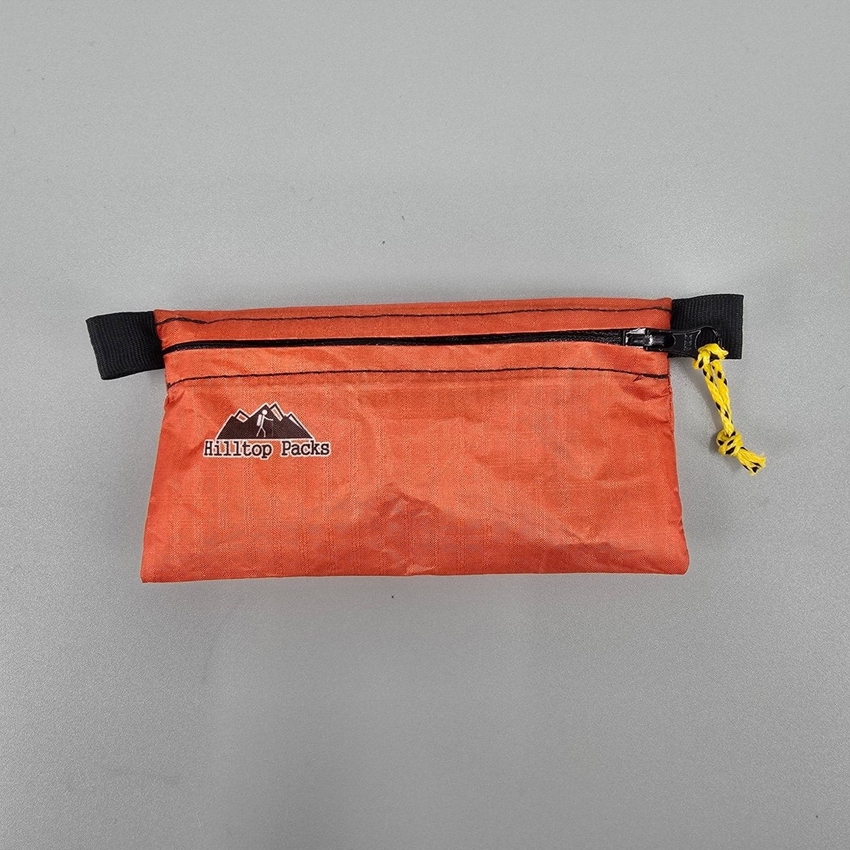 White ultralight zipper pouch organizer with classic pattern from Hilltop Packs LLC, ideal for organizing small essentials.