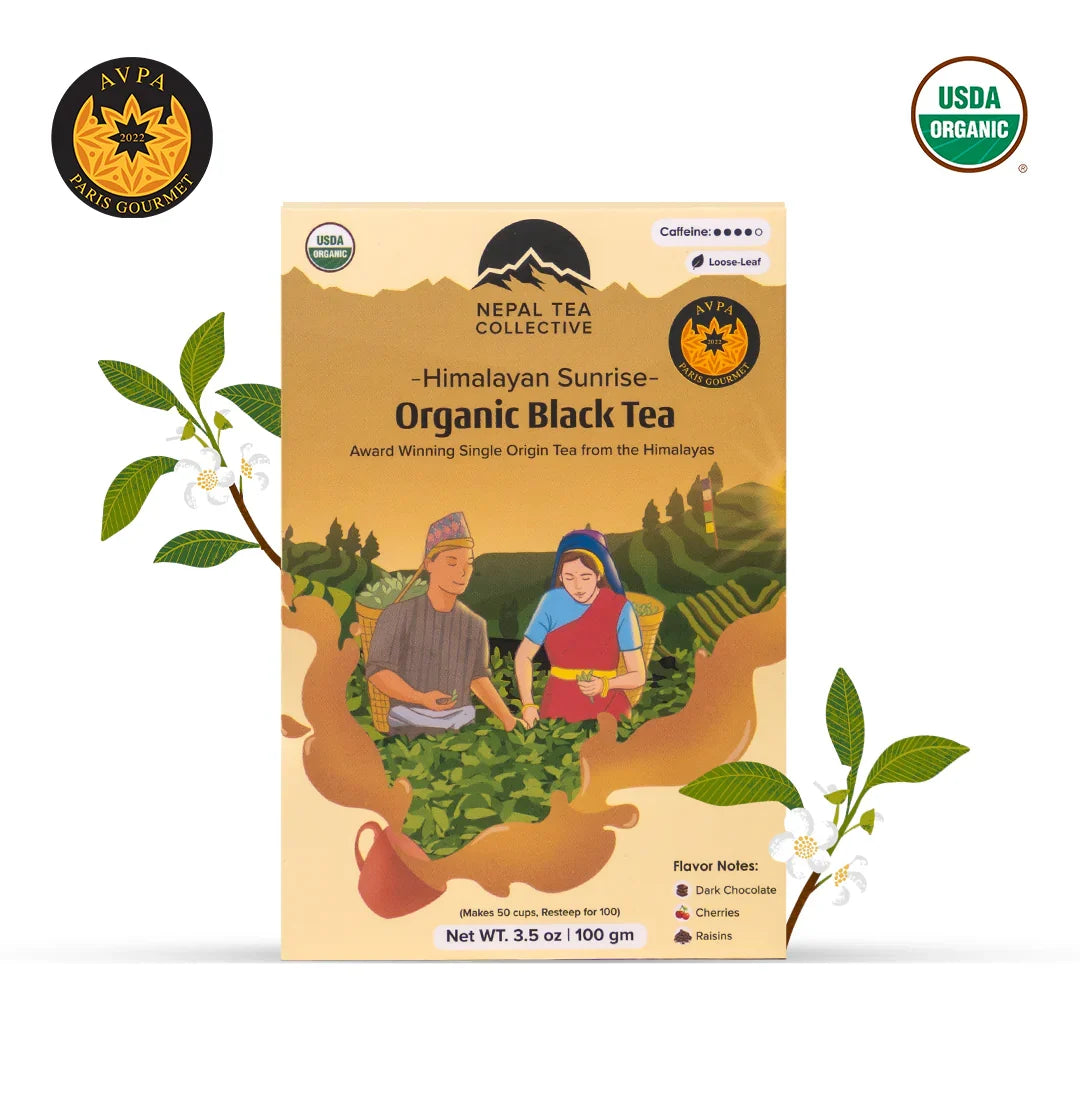 Organic Himalayan Sunrise Nepal Tea in a teacup, showcasing the rich amber color of the Kanchanjangha Noir tea.