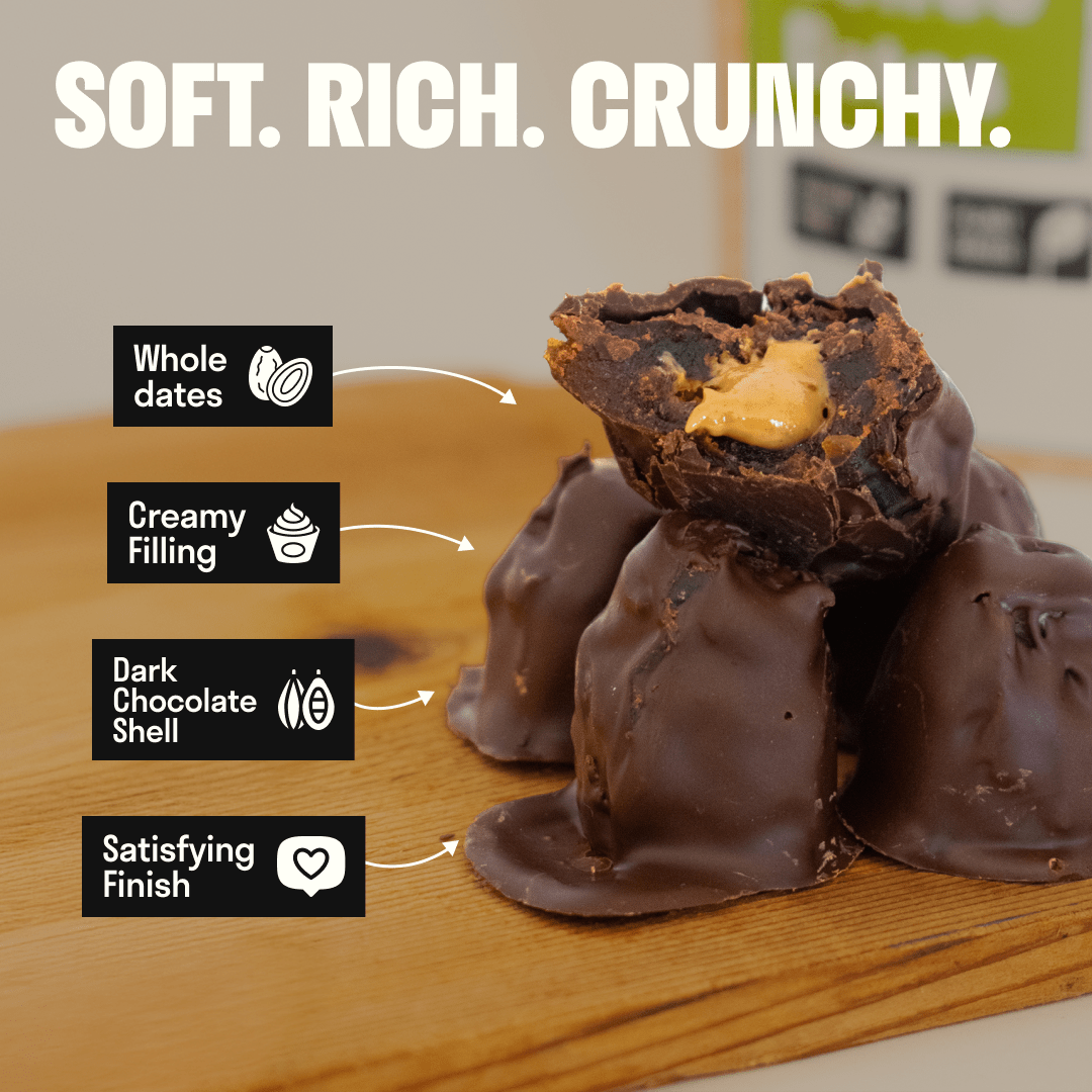 Single spiced dark chocolate stuffed Medjool date from Hot Date Kitchen, candied fruit with rich chocolate coating.