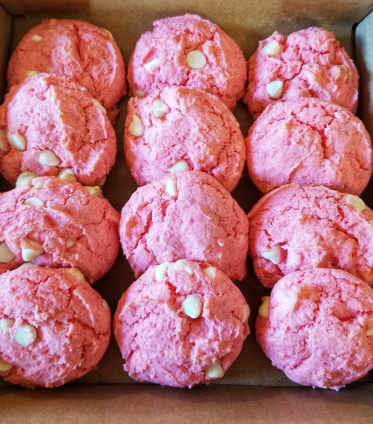 Assorted strawberry cookies from Let's Get Baked Artisan Desserts, featuring fresh strawberry flavors and decorative cookie designs.