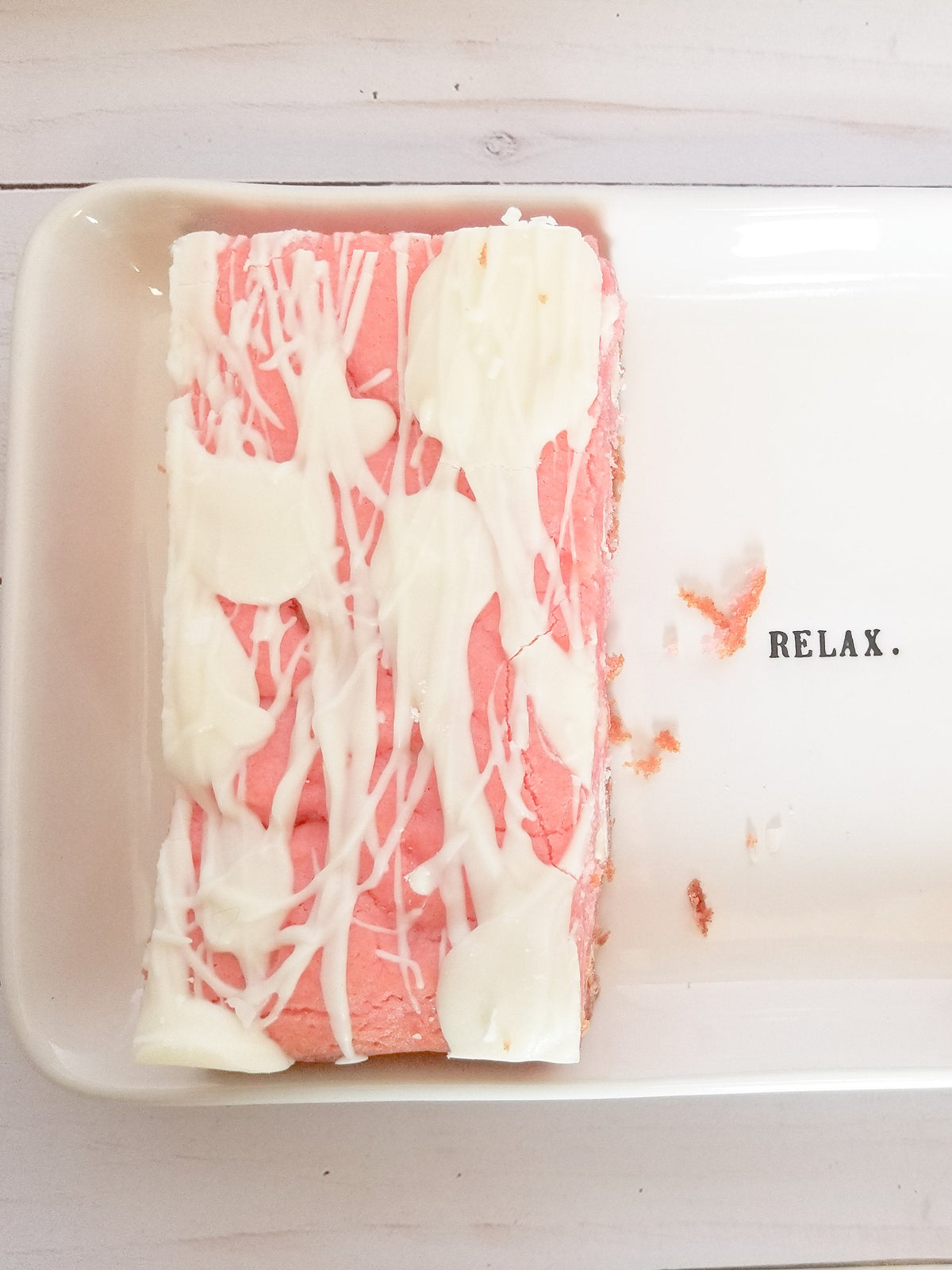 Strawberry Blondies from Let's Get Baked Artisan Desserts, showing a close-up of freshly baked cake bars with strawberry swirls.