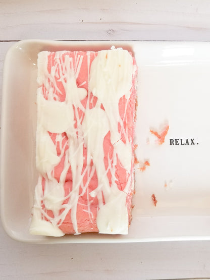 Strawberry Blondies from Let's Get Baked Artisan Desserts, showing a close-up of freshly baked cake bars with strawberry swirls.
