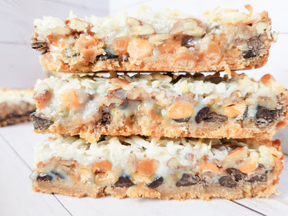 Assorted Let's Get Baked Artisan Desserts Magic Bars with chocolate, caramel, and coconut in a close-up view