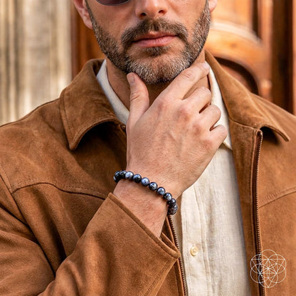 Black Moonstone bracelet from Conscious Items' Empath’s Cord Cutter collection, featuring smooth, polished stones on a black cord.