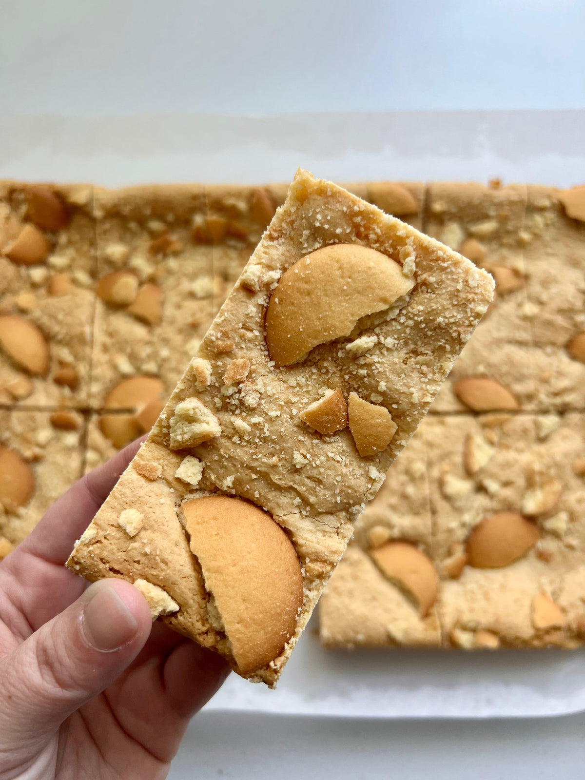 Banana pudding blondies from Let's Get Baked Artisan Desserts, featuring creamy banana pudding flavor in cake and dessert bar form.