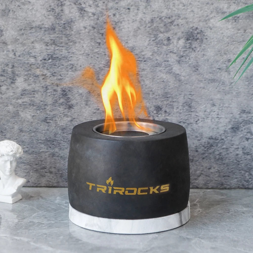 Indoor or outdoor portable fireplace with black graphite cement finish, suitable for gel and ethanol fuel, by JHY DESIGN.